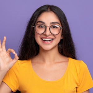 happy-insian-woman-gesturing-ok-sign-and-smiling-92S8ZBS-300x300-1.jpg