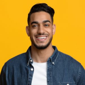 smiling-middle-eastern-man-in-casual-with-laptop-Y9EY47V-300x300-1.jpg